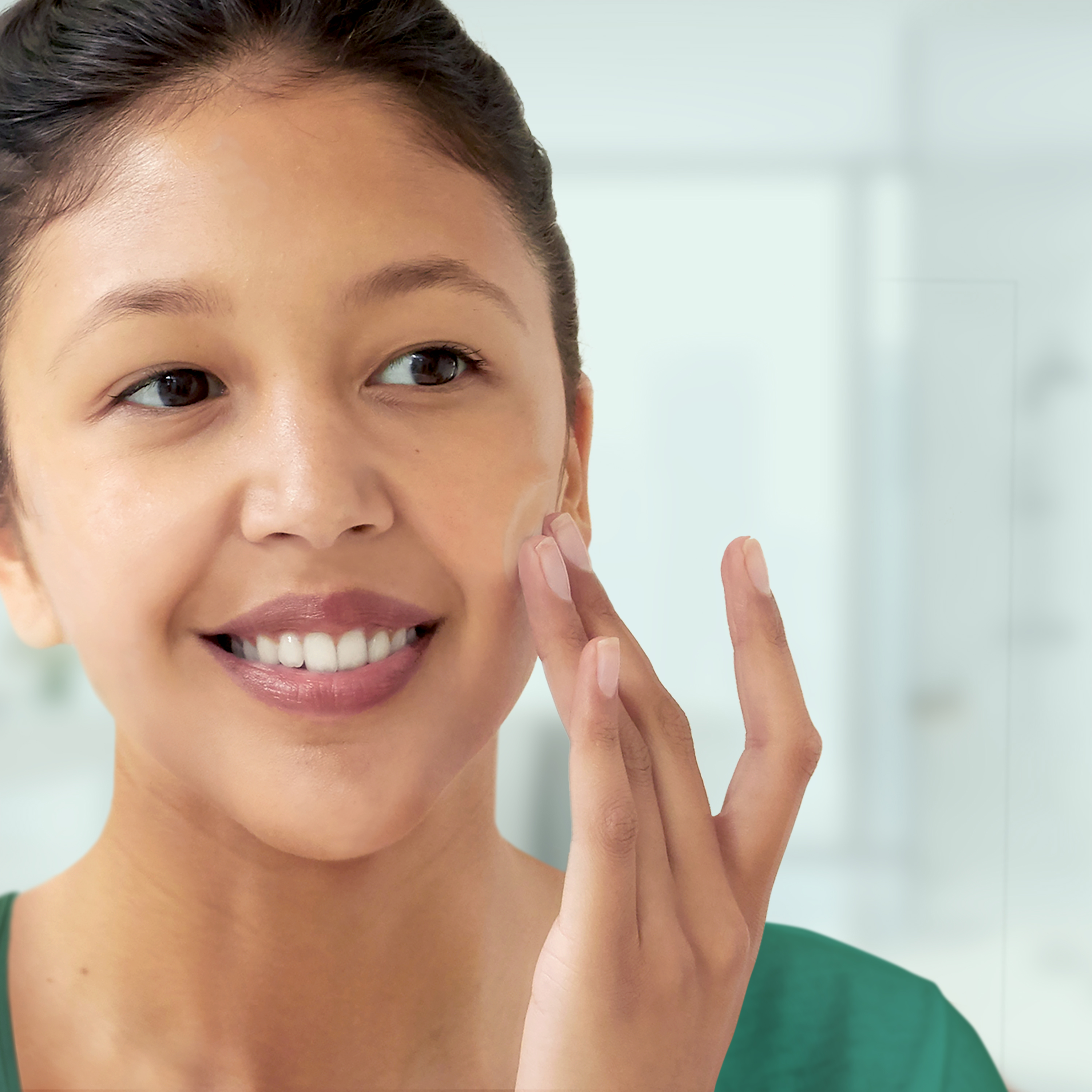 woman washing her face to help with acne prevention